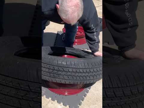 How in the world did he do that? Hand mounted a car tire.